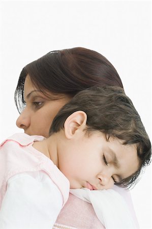 simsearch:630-02219591,k - Close-up of a girl sleeping on her mother's shoulder Stock Photo - Premium Royalty-Free, Code: 630-02220758