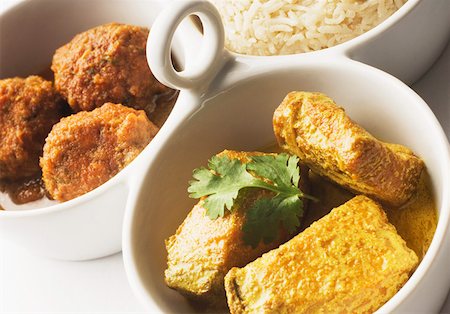 rice with stew - Close-up of boiled rice and meatballs with fish curry served in bowls Stock Photo - Premium Royalty-Free, Code: 630-02220752