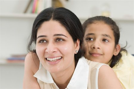 simsearch:630-02219353,k - Close-up of a girl hugging her mother from behind Stock Photo - Premium Royalty-Free, Code: 630-02220894