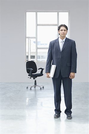 simsearch:630-02220576,k - Porträt eines Unternehmers mit einen Laptop in einem Büro Stockbilder - Premium RF Lizenzfrei, Bildnummer: 630-02220930