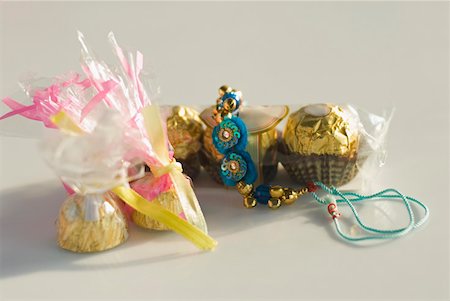 polythene - Close-up of a rakhi with sweets Stock Photo - Premium Royalty-Free, Code: 630-02221001