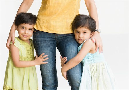 Two daughters hugging their mother Stock Photo - Premium Royalty-Free, Code: 630-02221017