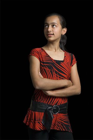 simsearch:630-02219279,k - Close-up of a girl standing with her arms crossed Foto de stock - Royalty Free Premium, Número: 630-02221013