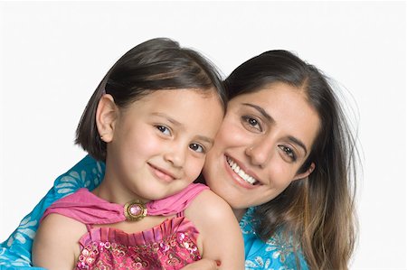 simsearch:630-02221095,k - Portrait of a young woman smiling with her daughter Foto de stock - Sin royalties Premium, Código: 630-02221093