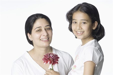 simsearch:630-02219353,k - Portrait of a girl giving a flower to her mother Stock Photo - Premium Royalty-Free, Code: 630-02221110