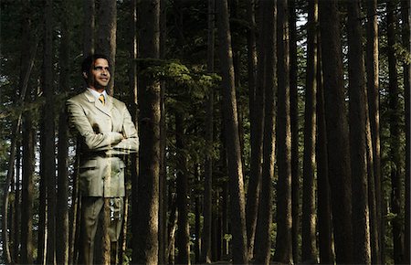 positive ideas - Businessman standing in a forest Stock Photo - Premium Royalty-Free, Code: 630-03479310