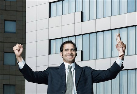 executive celebration - Close-up of a businessman smiling Stock Photo - Premium Royalty-Free, Code: 630-03479311