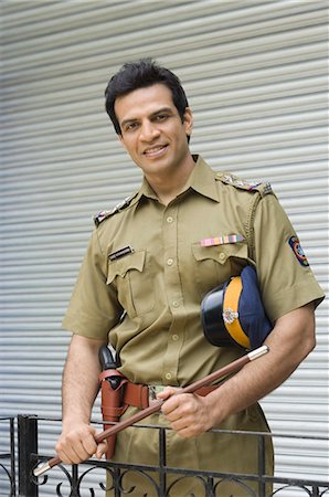 policemen - Portrait of a policeman smiling Stock Photo - Premium Royalty-Free, Code: 630-03479416