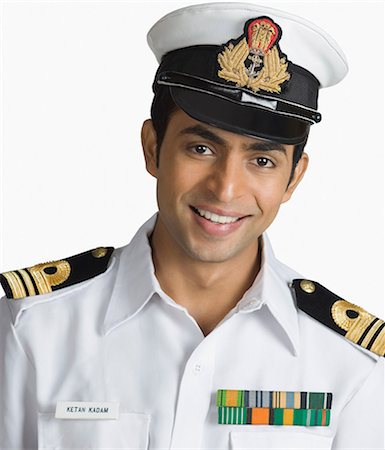 Portrait of a navy officer smiling Stock Photo - Premium Royalty-Free, Code: 630-03479425