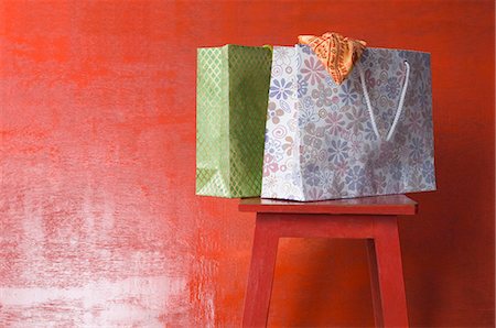 shopping bag closeup - Close-up of shopping bags on a stool Stock Photo - Premium Royalty-Free, Code: 630-03479455
