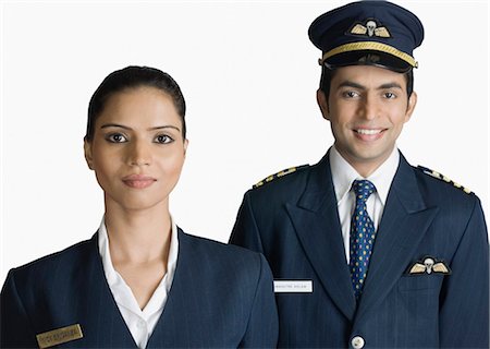 Portrait of a pilot with an air hostess Stock Photo - Premium Royalty-Free, Code: 630-03479528