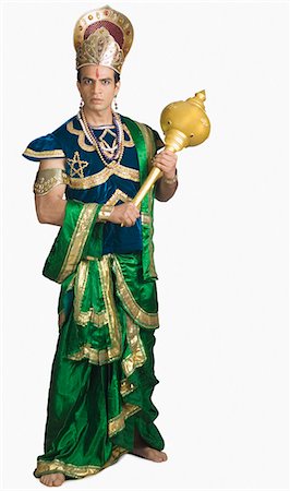 stage costume - Young man dressed-up as Bhima and holding a mace Stock Photo - Premium Royalty-Free, Code: 630-03479540