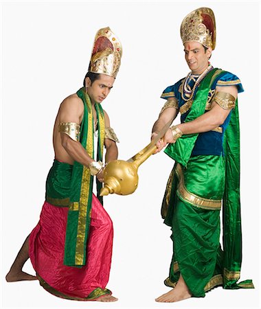 simsearch:630-03481388,k - Two young men fighting in a character of Hindu epic Foto de stock - Sin royalties Premium, Código: 630-03479561