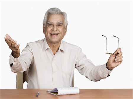 eyeglasses for indian men - Portrait of a senior man smiling Stock Photo - Premium Royalty-Free, Code: 630-03479592