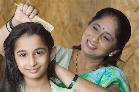 pictures of east indian women with bindi - Mature woman combing hair of her granddaughter Stock Photo - Premium Royalty-Free, Code: 630-03479609