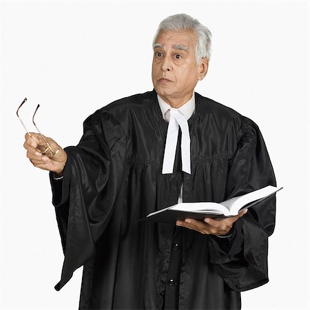 Male lawyer holding a book Stock Photo - Premium Royalty-Free, Code: 630-03479623