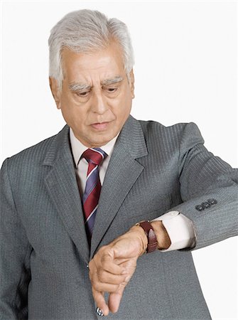 simsearch:630-03479325,k - Close-up of a businessman checking the time Stock Photo - Premium Royalty-Free, Code: 630-03479647