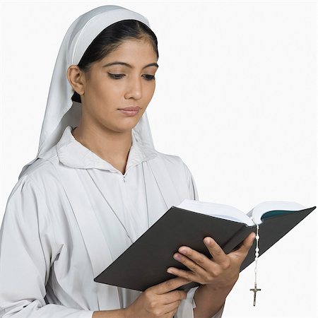 praying indian - Nun reading the Bible Stock Photo - Premium Royalty-Free, Code: 630-03479675