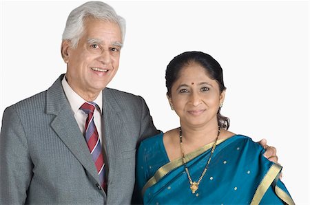 retired indian couple - Portrait of a senior man arm around a mature woman and smiling Stock Photo - Premium Royalty-Free, Code: 630-03479678