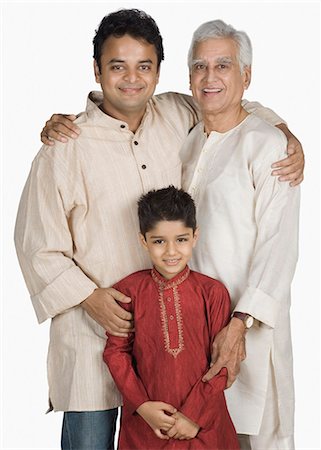 senior man happy studio - Portrait of a family standing together and smiling Stock Photo - Premium Royalty-Free, Code: 630-03479729