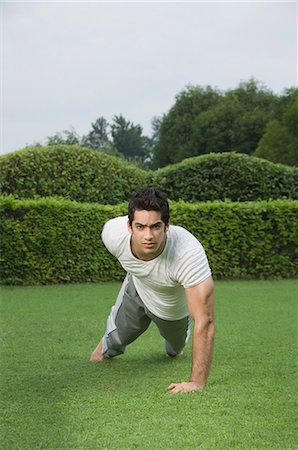 Man exercising in a park Stock Photo - Premium Royalty-Free, Code: 630-03479799