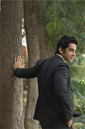 suit gentleman - Rear view of a businessman standing in a park Stock Photo - Premium Royalty-Free, Code: 630-03479834