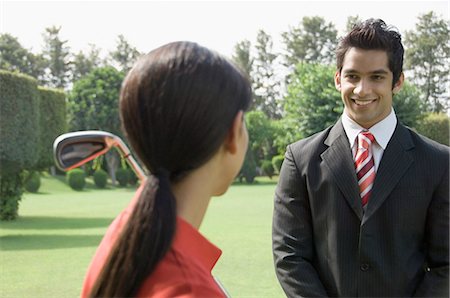 Couple in a golf course Stock Photo - Premium Royalty-Free, Code: 630-03479900