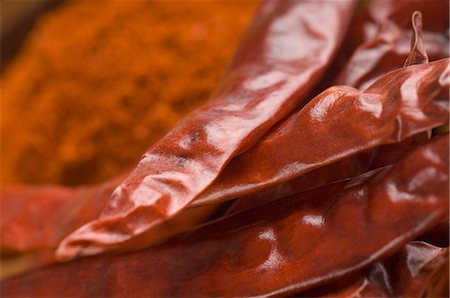 still life chili - Close-up of red chili peppers with paprika Stock Photo - Premium Royalty-Free, Code: 630-03480030