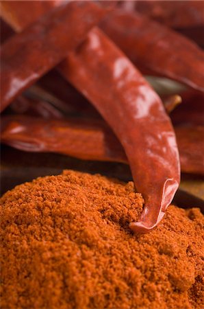 still life chili - Close-up of red chili peppers with paprika Stock Photo - Premium Royalty-Free, Code: 630-03480031