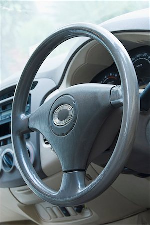 steering wheel - Close-up of a car steering wheel, Delhi, India Stock Photo - Premium Royalty-Free, Code: 630-03480178