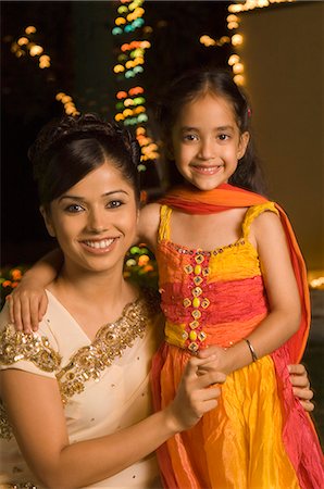 deepavali family - Woman with her daughter smiling Stock Photo - Premium Royalty-Free, Code: 630-03480212