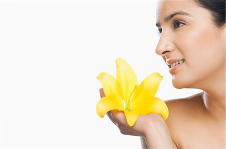 simsearch:695-05777392,k - Woman holding a flower Foto de stock - Sin royalties Premium, Código: 630-03480266