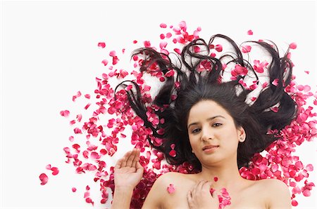 pink, rose, white background - Woman lying on rose petals Stock Photo - Premium Royalty-Free, Code: 630-03480293