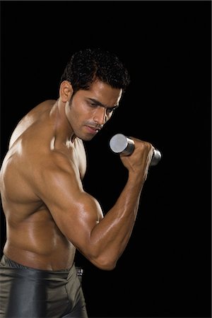 simsearch:6105-05397166,k - Man exercising with dumbbells Stock Photo - Premium Royalty-Free, Code: 630-03480313