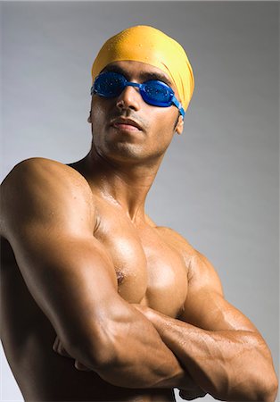 Swimmer standing with his arms crossed Stock Photo - Premium Royalty-Free, Code: 630-03480341