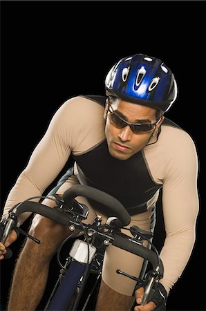 people on racing bikes - Cyclist riding a racing bicycle Stock Photo - Premium Royalty-Free, Code: 630-03480372