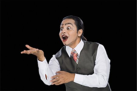funny indian man - Close-up of a mime gesturing Stock Photo - Premium Royalty-Free, Code: 630-03480590