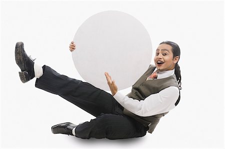 exaggerating - Businessman holding a blank circular placard Stock Photo - Premium Royalty-Free, Code: 630-03480629