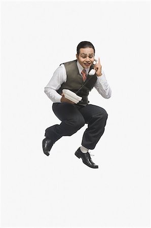 funny person jumping - Mime talking on the phone Stock Photo - Premium Royalty-Free, Code: 630-03480621