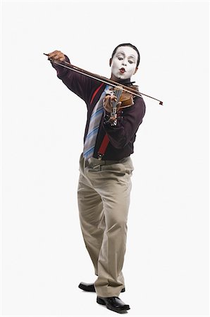 simsearch:630-06722257,k - Mime playing a violin Foto de stock - Royalty Free Premium, Número: 630-03480656