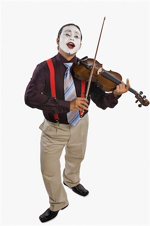 simsearch:630-06722257,k - Mime playing a violin Foto de stock - Royalty Free Premium, Número: 630-03480651