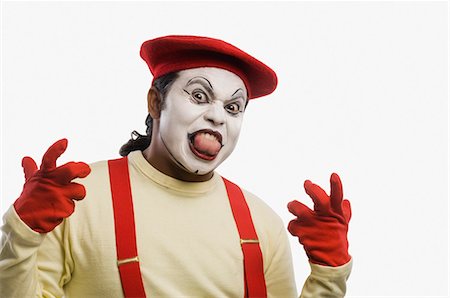 simsearch:632-01148987,k - Portrait of a mime sticking his tongue out Stock Photo - Premium Royalty-Free, Code: 630-03480696