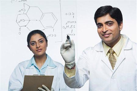 Scientists at work on a problem Stock Photo - Premium Royalty-Free, Code: 630-03480983