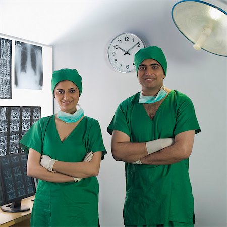 Portrait of two surgeons smiling Stock Photo - Premium Royalty-Free, Code: 630-03481017