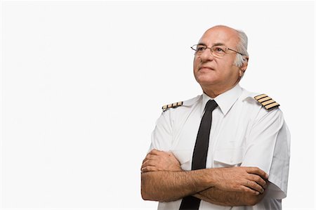Pilot day dreaming with his arms crossed Stock Photo - Premium Royalty-Free, Code: 630-03481094