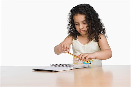 simsearch:630-03481154,k - Close-up of a girl holding a pencil Foto de stock - Sin royalties Premium, Código: 630-03481190