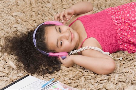 drawing a person lying down - Close-up of a girl listening to headphones Stock Photo - Premium Royalty-Free, Code: 630-03481214