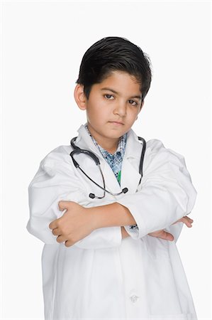 Boy looking serious in a lab coat Stock Photo - Premium Royalty-Free, Code: 630-03481243