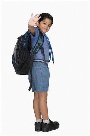 preteen boy happy white background - Schoolboy leaving for the school Stock Photo - Premium Royalty-Free, Code: 630-03481290