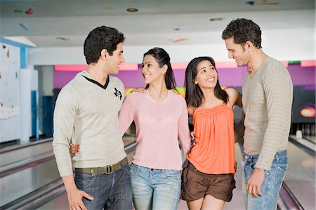 simsearch:630-03481611,k - Two young couples in a bowling alley Stock Photo - Premium Royalty-Free, Code: 630-03481586